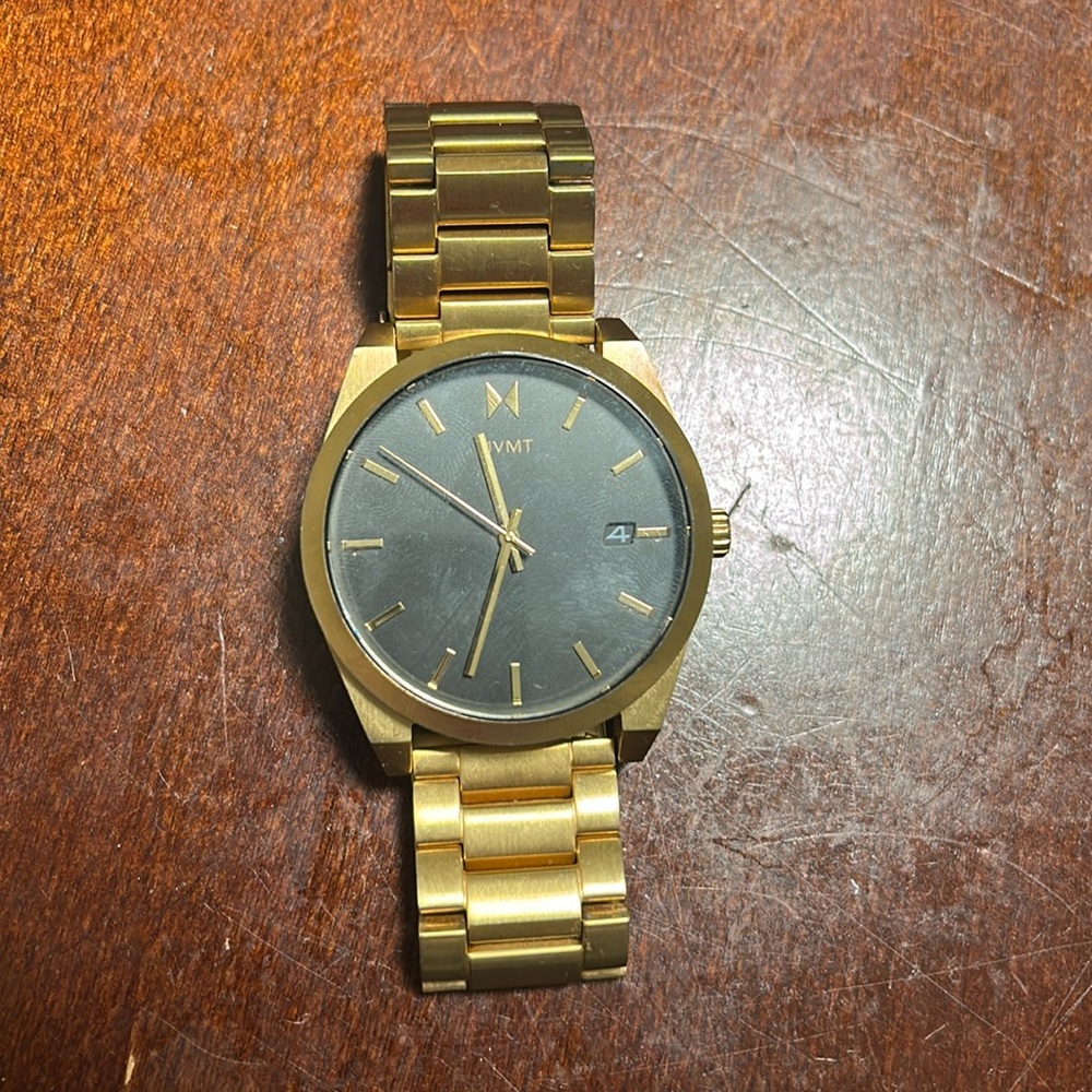 Gold men’s mvmt watch